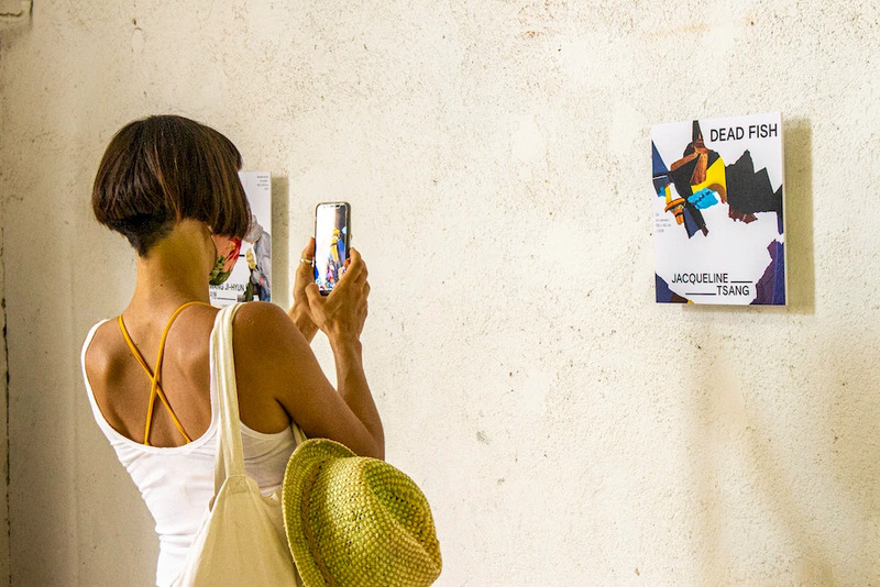 Exhibition visitor scans an app marker on the gallery wall
